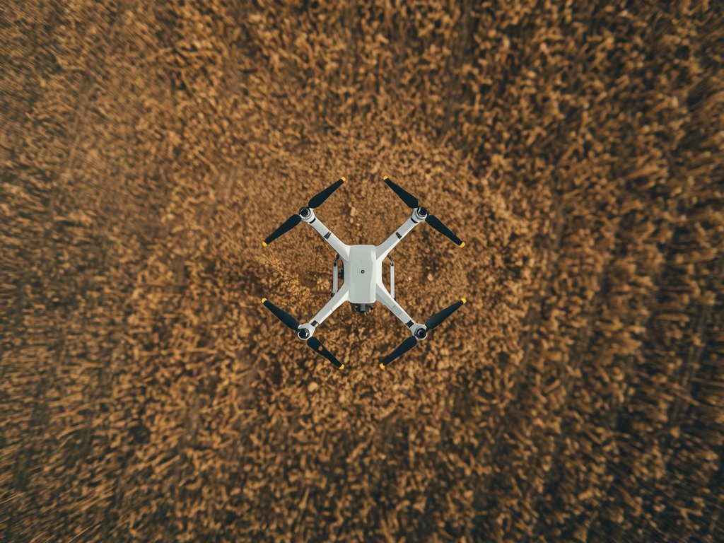 An aerial view of a drone mapping a vast agricultural